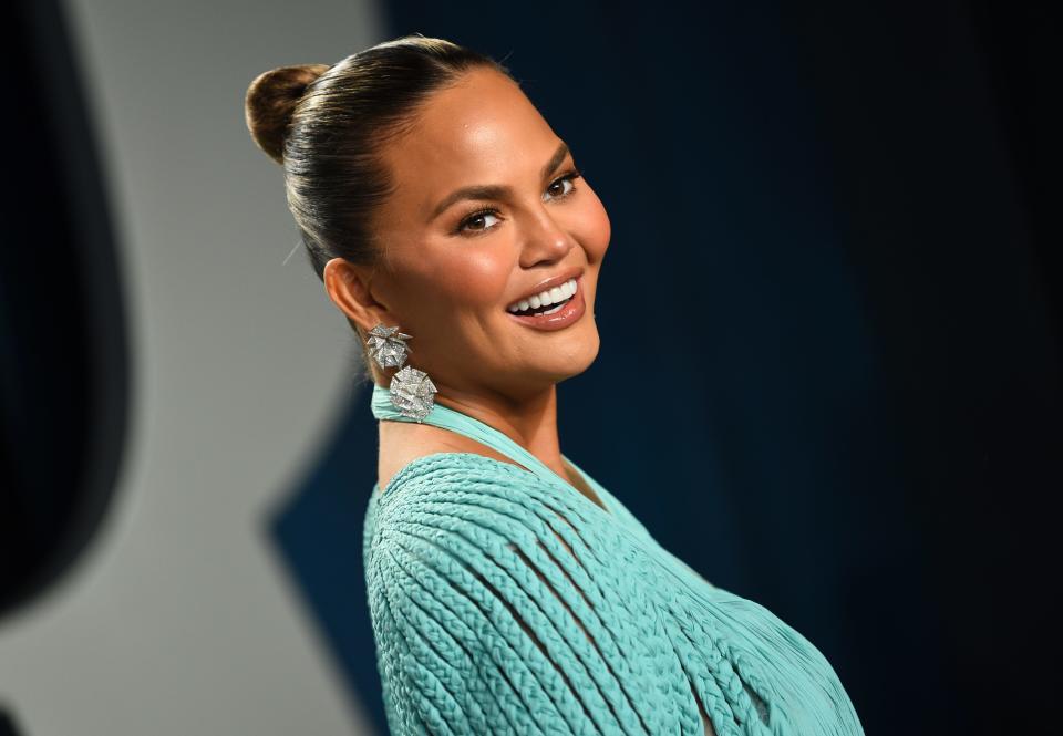 FILE - In this Feb. 9, 2020, file photo, Chrissy Teigen arrives at the Vanity Fair Oscar Party in Beverly Hills, Calif. Teigen has deleted her popular Twitter account, saying the site no longer plays a positive role in her life and has become a negative part on her life. (Photo by Evan Agostini/Invision/AP, File) ORG XMIT: NYDB506