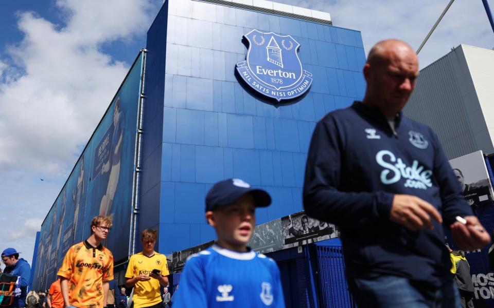 Fans arrive outside the stadium prior to the Premier League match between Everton FC and Wolverhampton Wanderers