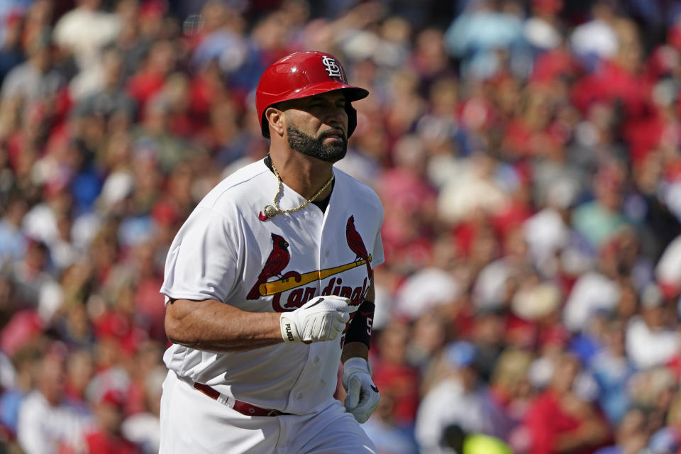 St. Louis Cardinals' Albert Pujols runs to first on a ground out during the fourth inning in Game 1 of a National League wild card baseball playoff series against the Philadelphia Phillies, Friday, Oct. 7, 2022, in St. Louis. (AP Photo/Jeff Roberson)