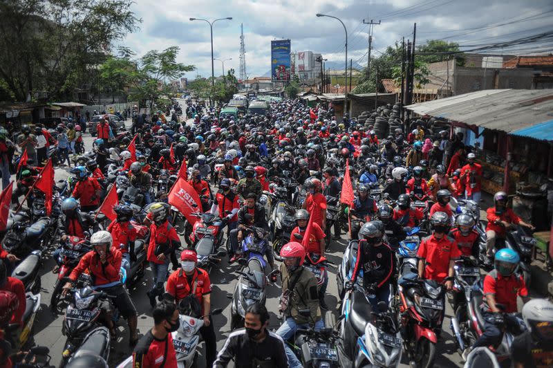 Members of Indonesian trade unions protest the government's proposed labour reforms in a controversial "jobs creation" bill in Bandung