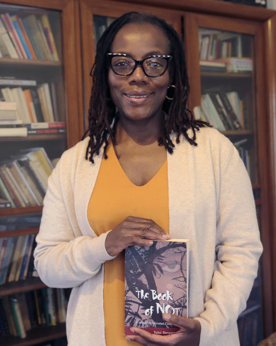 Zimbabwean author Tsitsi Dangarembwa poses for a photograph, at her home in Harare, Tuesday, June 22, 2021. The Peace Prize of the German Book Trade, which is endowed with 25,000 euros ($29,700), has been awarded since 1950. Dangarembga will receive it in Frankfurt on Oct. 24. (AP Photo/Tsvangirayi Mukwazhi)