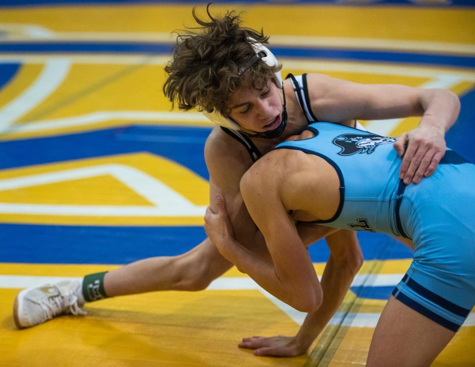 Quaker Valley's Jack Kazalas, top, battles Burrell's Cooper Hornack in the 106 lb. semifinal of  the WPIAL AA  wrestling championships Saturday at Canon McMillan High School in Canonsburg.