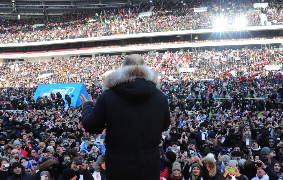 <p>Russia’s President Vladimir Putin addresses a rally in his support at the Luzhniki Stadium ahead of the 2018 Russian presidential election scheduled for March 18. (Photo: Mikhail Klimentyev/TASS via Getty Images) </p>