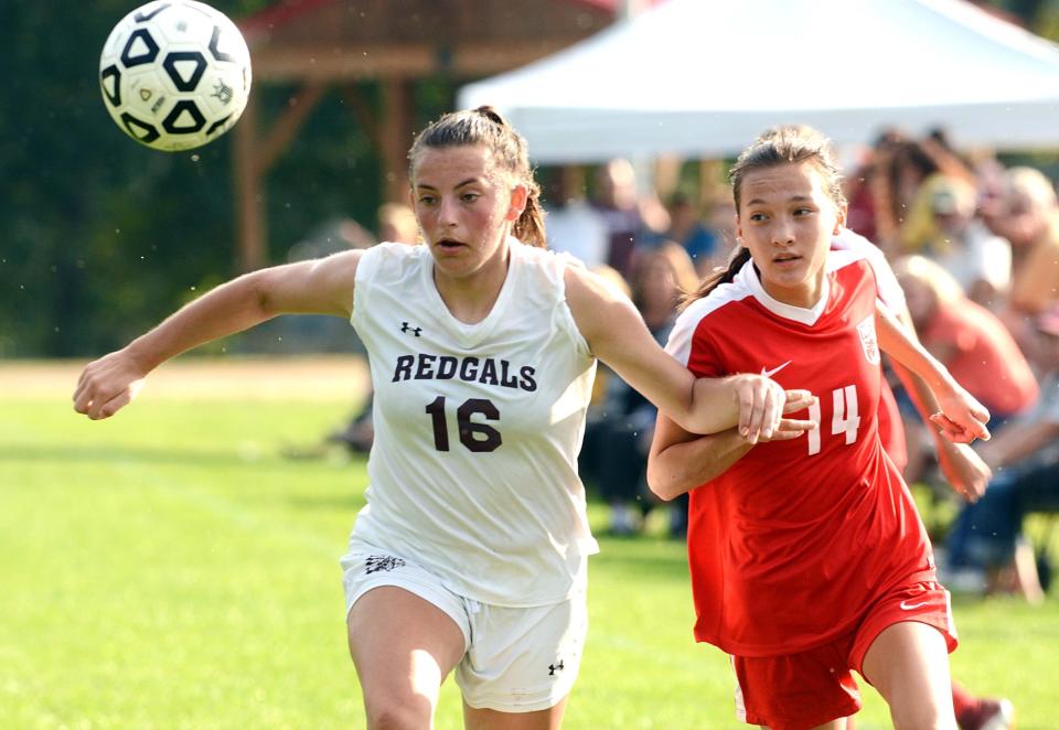 NFA's Kayla Park, right, and Killingly's Hannah Siegmund battle for the ball in Norwich.
