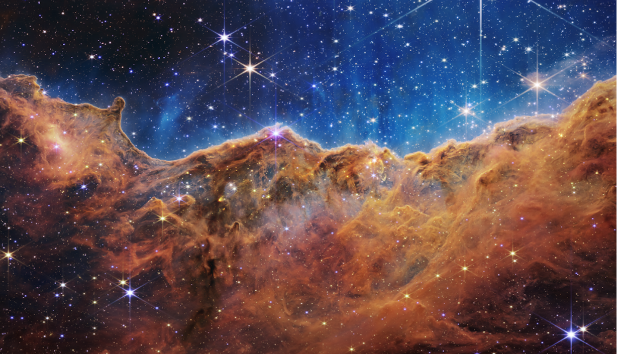 "Cosmic cliffs” in the Carina nebula, captured by the James Webb Space Telescope. <a href="https://webbtelescope.org/contents/media/images/2022/031/01G77PKB8NKR7S8Z6HBXMYATGJ" rel="nofollow noopener" target="_blank" data-ylk="slk:NASA, ESA, CSA, STScI;elm:context_link;itc:0;sec:content-canvas" class="link ">NASA, ESA, CSA, STScI</a>