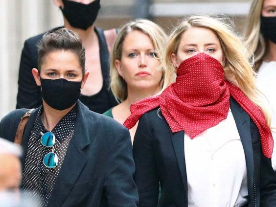 Actor Amber Heard leaves the High Court in London on day three of actor Johnny Depp's libel trial against The Sun's publishers and executive editor, 9 July 2020. (REUTERS)