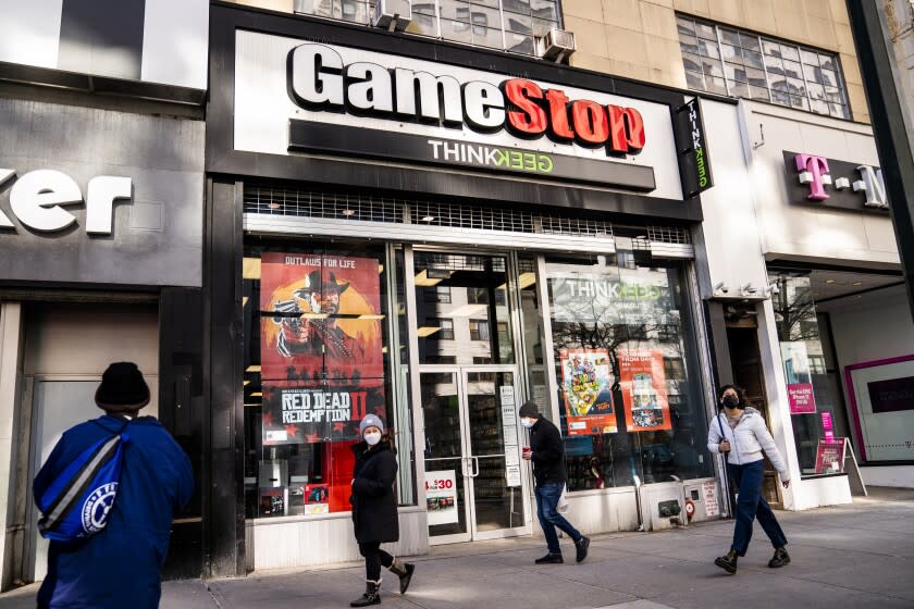 FILE - Pedestrians pass a GameStop store on 14th Street at Union Square, Thursday, Jan. 28, 2021, in the Manhattan borough of New York. GameStop shares are on track for their biggest one-day loss ever, extending a skid that's cleaved off some of its recent blockbuster gains following a social-media led campaign to get the videogame retailer's stock to skyrocket. Shares were down 46% to about $120 in morning trading Tuesday, Feb. 2, following a 31% decline a day earlier. (AP Photo/John Minchillo, File)