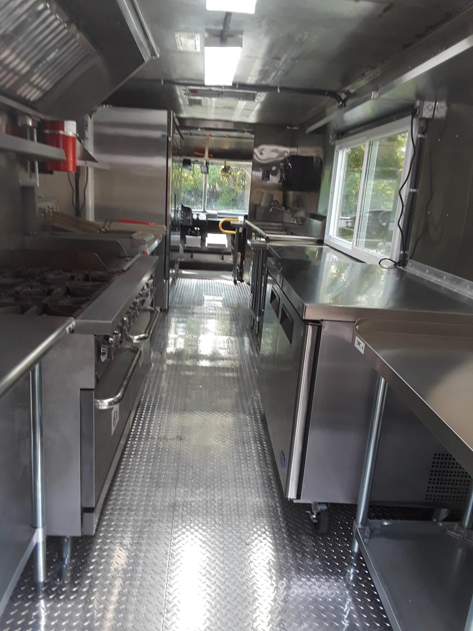 Chef Michael Jay is working on getting a 24-foot food trailer ready to open outside Chef Mike's Gourmet, a new take-out and delivery restaurant coming soon to Brighton Township.