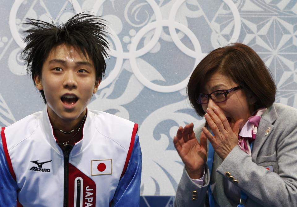 Japan's Yuzuru Hanyu reacts in the "kiss and cry" area during the Figure Skating Men's Short Program at the Sochi 2014 Winter Olympics