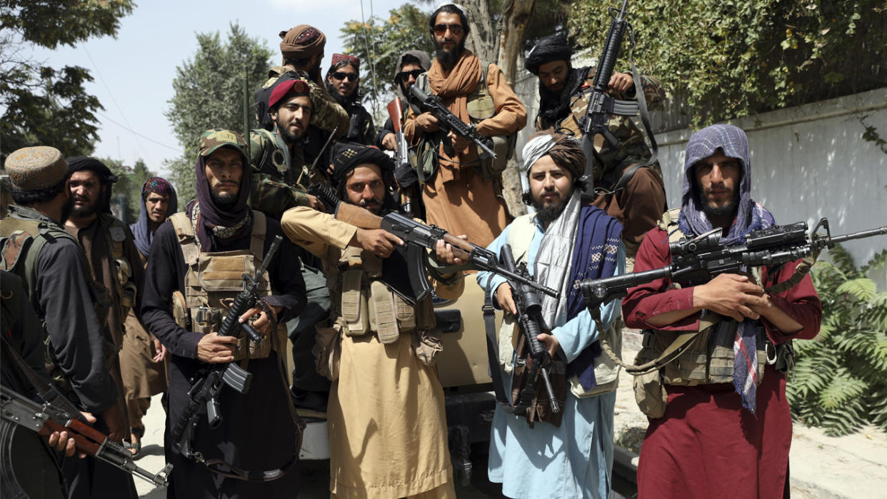 Taliban fighters pose for a photograph in Kabul, Afghanistan, Thursday, Aug. 19, 2021. (Rahmat Gul/AP Photo)