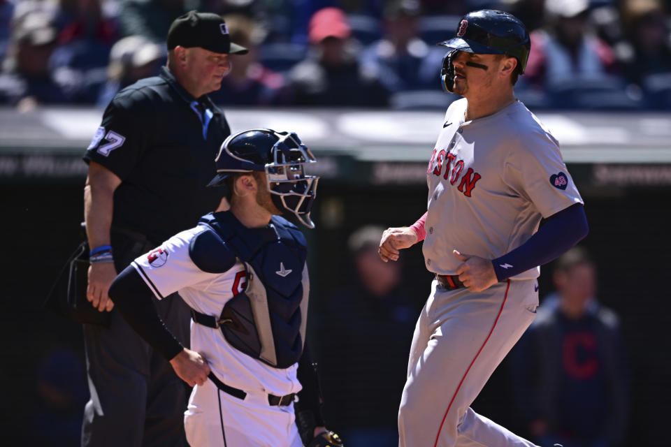 Boston Red Sox's Reese McGuire scores a run on an RBI-single by Jarren Duran during the sixth inning of a baseball game against the Cleveland Guardians, Thursday, April 25, 2024, in Cleveland. (AP Photo/David Dermer)