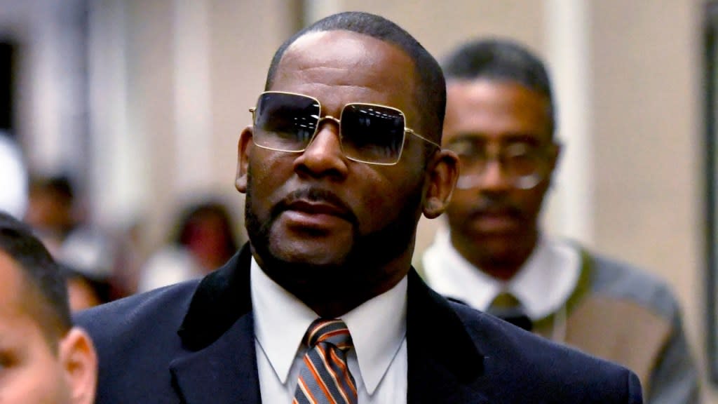 R. Kelly leaves the Daley Center after a hearing in his child support case in May 2019 in Chicago. Kelly’s lawyer told an appeals court Monday that prosecutors improperly used a racketeering statute written to shut down organized crime to go after the singer. (Photo: Matt Marton/AP, File)