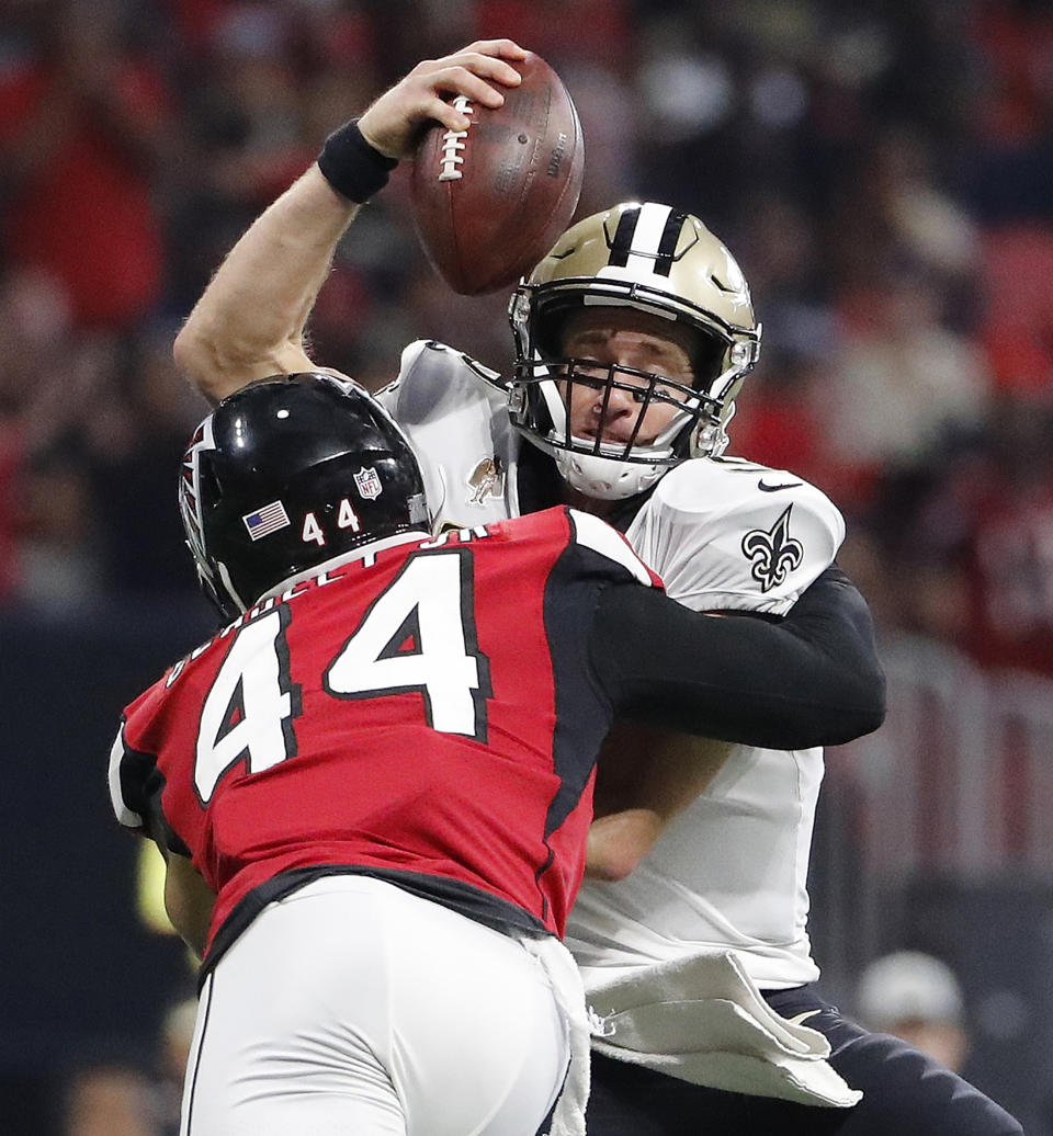 New Orleans Saints quarterback Drew Brees (9) is sacked by Atlanta Falcons linebacker Vic Beasley (44) during the second half of an NFL football game, Sunday, Sept. 23, 2018, in Atlanta. (AP Photo/David Goldman)