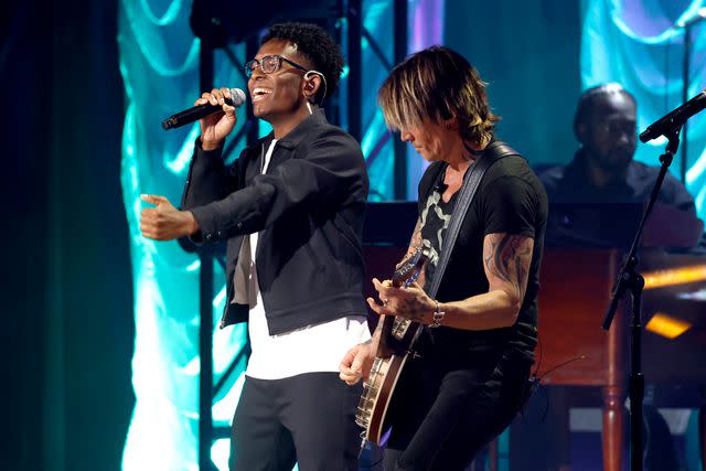 <p>Jason Kempin/Getty</p> BRELAND and Keith Urband perform at the ACM Honors on Aug. 23, 2023 in Nashville