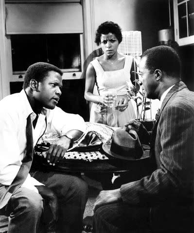 <p>Courtesy Everett Collection</p> From L: Sidney Poitier, Ruby Dee and Louis Gossett Jr. in <em>A Raisin in the Sun</em> (1961)