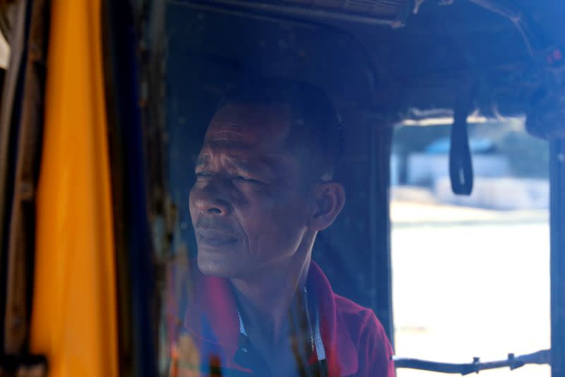 Cambodian tuk-tuk driver Kwan Samhay waits for customers in Sihanoukville