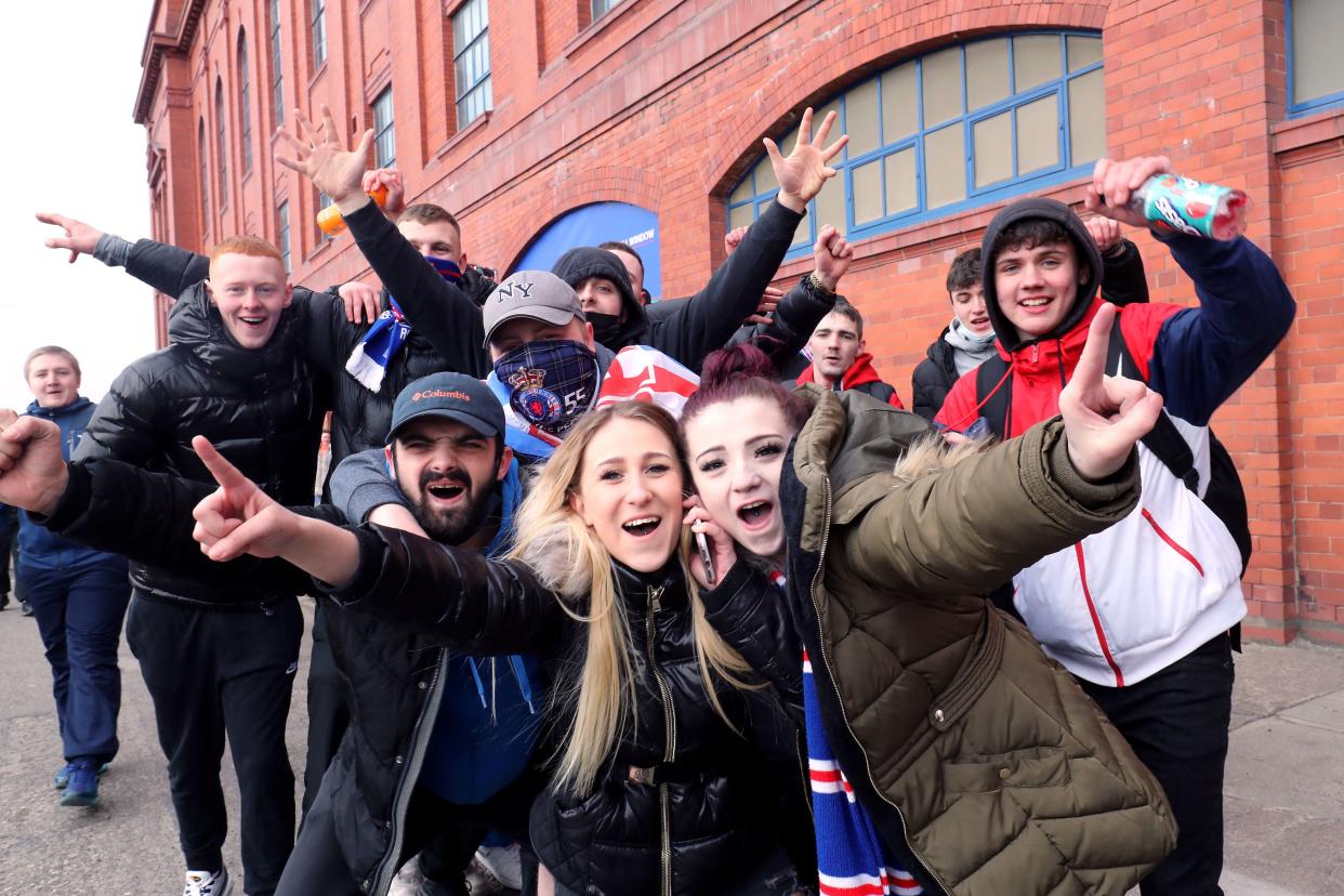 <p>Rangers fans gathered in large numbers outside the Ibrox Stadium </p> (PA)