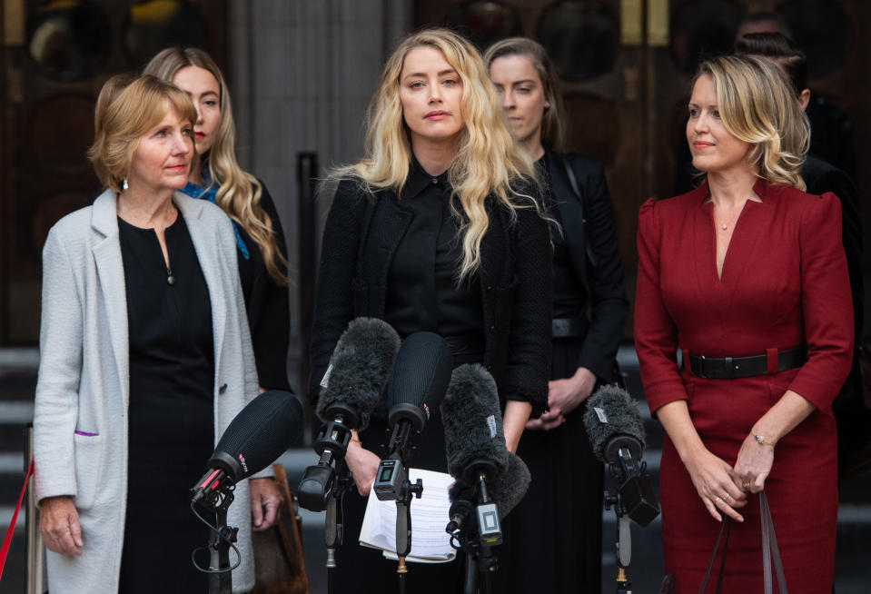 Amber Heard reads a statement after the libel trial at the Royal Courts of Justice in London on July 28, 2020. (Photo by Samir Hussein/WireImage)