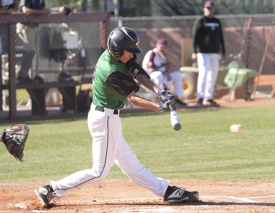 San Luis' Ernesto Ochoa (8) bats against Hamilton during play at Hamilton High school baseball field in Chandler on March 28, 2023.