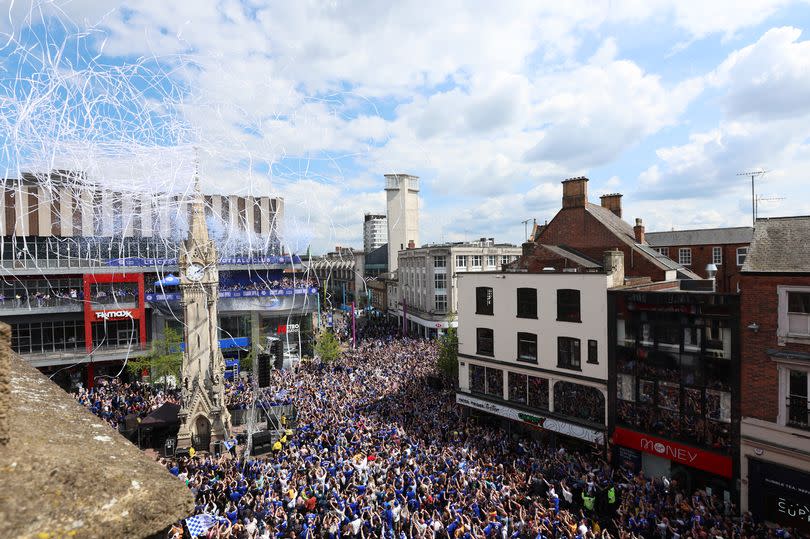 A general view as fans line the streets, as The Haymarket Memorial Clock Tower is seen, during the Leicester City trophy parade.