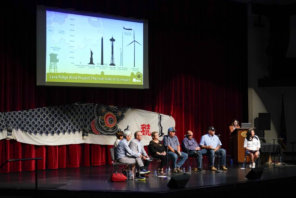 Friends of Minidoka executive director Robyn Achilles, seated at far right, leads a panel of farmers, legislators and camp survivor descendants to discuss the Lava Ridge wind farm project proposed to be built near Minidoka National Historic Site at the College of Southern Idaho, Friday, July 7, 2023, in Twin Falls, Idaho. The largest of the wind turbines would be 740 feet tall, higher than the Seattle Space Needle. (AP Photo/Lindsey Wasson)