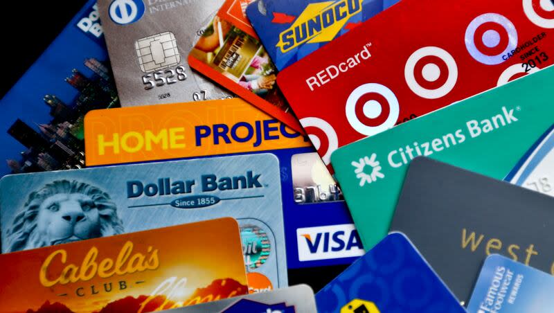 In this Jan. 31, 2018, photo, an assortment of credit cards and rewards cards are shown in Zelienople, Pa. The United States has nearly $1.3 trillion in credit card debt, adding as much as $108 billion in 2023 alone, according to a WalletHub study that looked into which U.S. cities had the most debt.