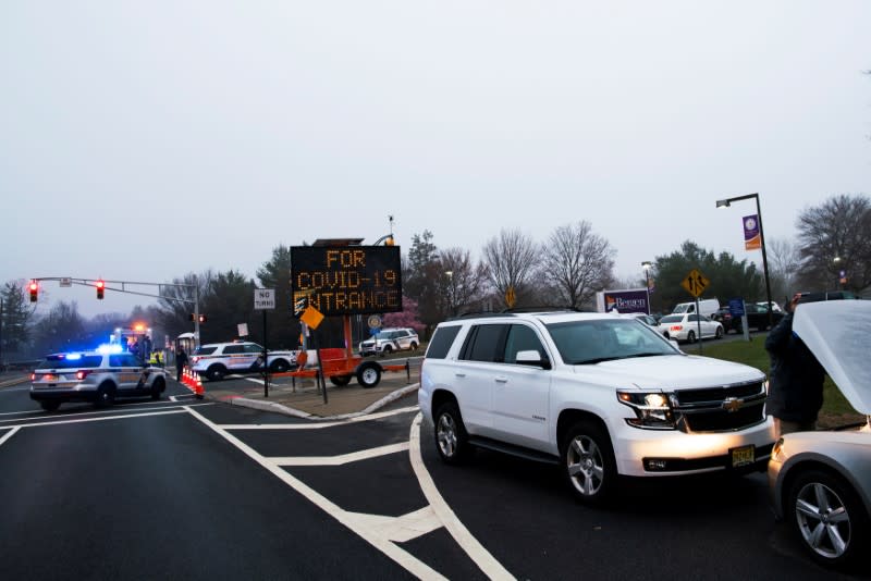 People wait in their cars to go testing at a new drive-thru coronavirus disease (COVID-19) testing center at Bergen Community College in Paramus, New Jersey