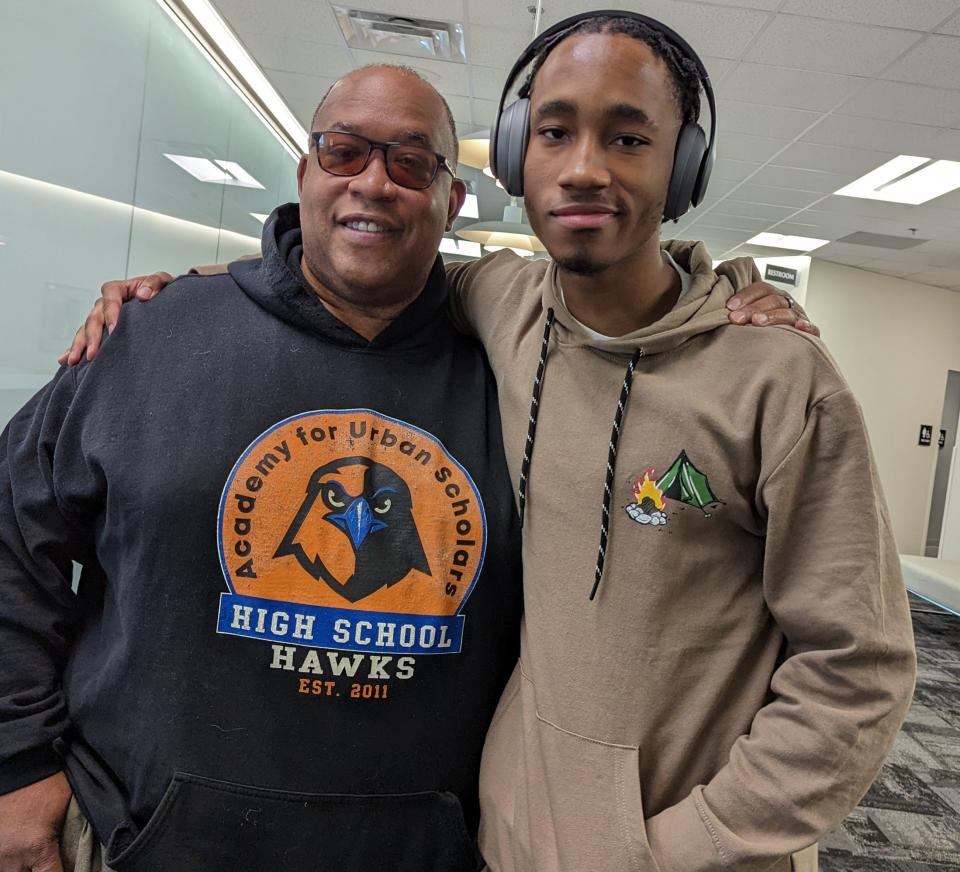 Samuel Muhammad is shown with student DeAndre McCole, 21, who says the Academy for Urban Scholars High School is giving him a second chance at life.
