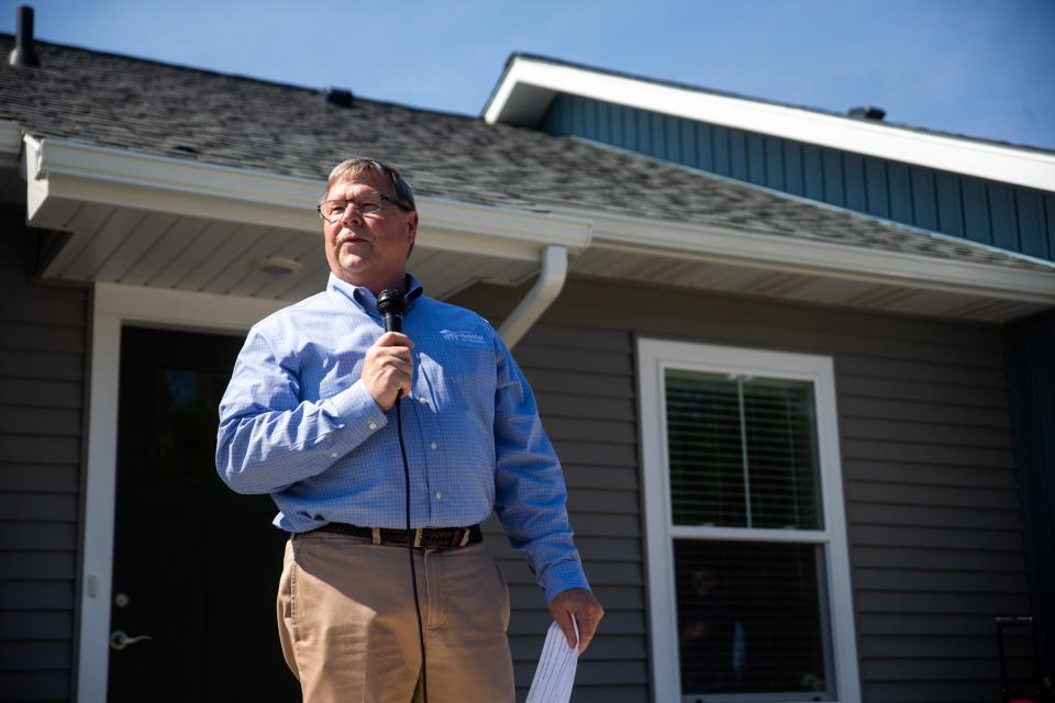 Don Wilkinson speaks during a ribbon cutting for Lakeshore Habitat's Haven Townhomes Wednesday, Aug. 16.