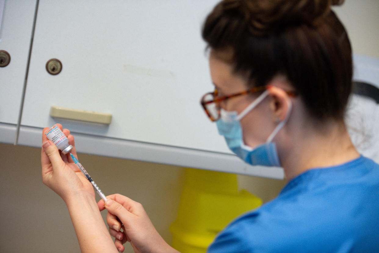 A healthcare professional draws up a dose of the Moderna Covid-19 vaccine at the West Wales General Hospital in Carmarthen, Wales, on April 7, 2021. - Britain on April 7 began rolling out its third coronavirus vaccine, from US company Moderna, as questions mounted over jabs from the country's main supplier, AstraZeneca. The Moderna vaccine, which is already being delivered in Europe and the United States, joined ones from AstraZeneca-Oxford University and Pfizer-BioNTech in Britain's armoury against Covid-19. The first jabs of the two-stage Moderna inoculation were injected at a hospital in Wales, in a timely diversification of Britain's rollout that was hailed by Prime Minister Boris Johnson. (Photo by Jacob King / POOL / AFP) (Photo by JACOB KING/POOL/AFP via Getty Images)