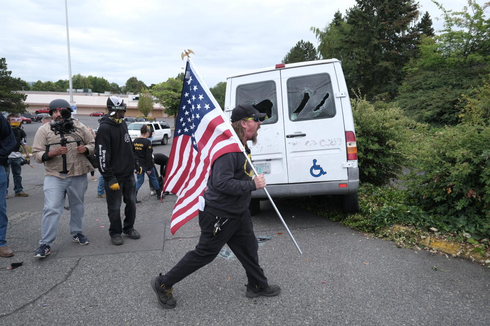 A man reacts after anti-fascist protesters drove towards members of the far-right group Proud Boys as they rally in an abandoned parking lot on Sunday, Aug. 22, 2021, in Portland, Ore. (AP Photo/Alex Milan Tracy)