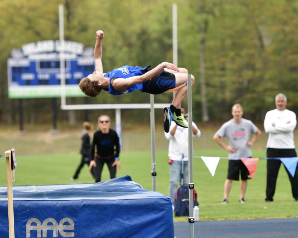 Inland Lakes' Sam Schoonmaker jumps in the boys high jump event on Friday. Schoonmaker finished second.