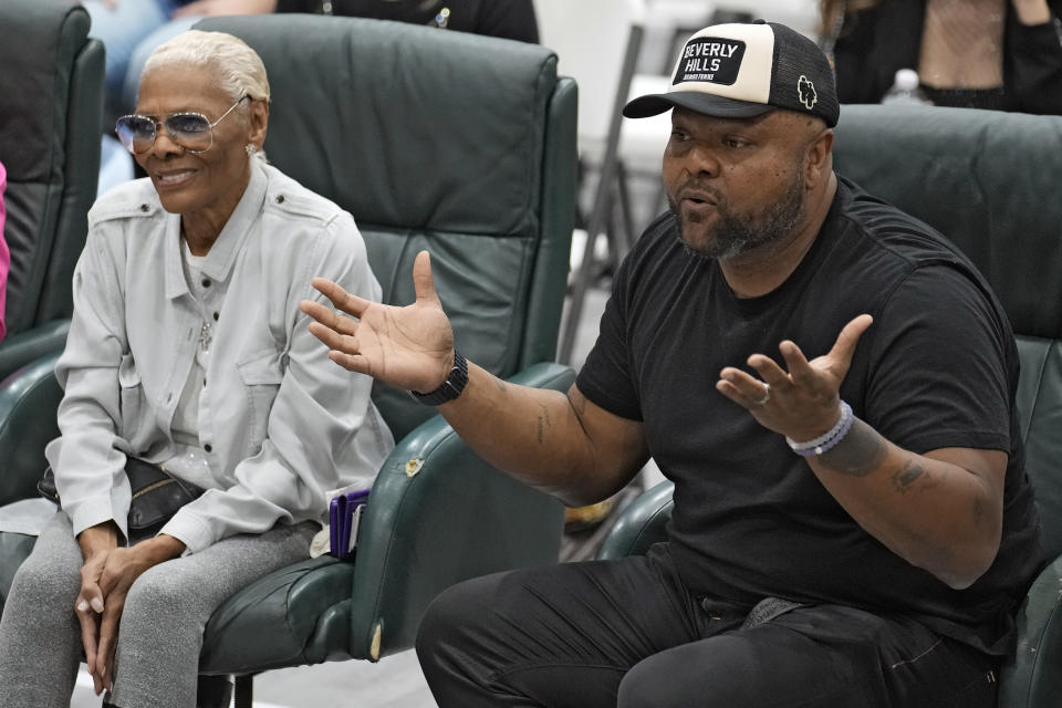 Damon Elliott, right, and his mother, singer Dionne Warwick, react as they watch during a rehearsal for the touring show "Hits! The Musical" Wednesday, Feb. 8, 2023, in Clearwater, Fla. The Grammy-winning, multimillion-selling singer and her Oscar-nominated son Damon Elliott are co-producing an upcoming 50-city touring show. AP Photo/Chris O'Meara)