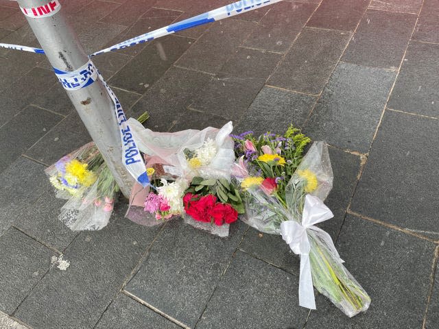 Flowers left near the scene at Woolwich New Road