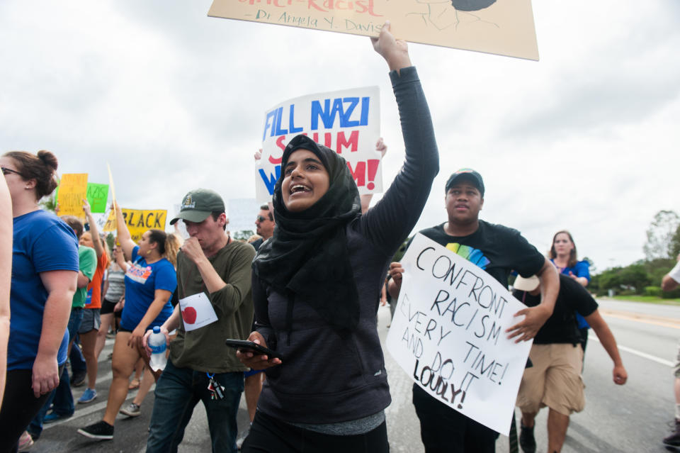 Mushrat Nuri, a student at University of Florida in Gainesville, marches down 34th Street.&nbsp;