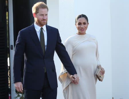 Britain's Prince Harry and Meghan, Duchess of Sussex arrive for a reception hosted by the British Ambassador to Morocco at the British Embassy in Rabat, Morocco February 24, 2019. Yui Mok/Pool via REUTERS/Files