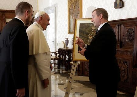 Pope Francis exchanges gifts with Irish Prime Minister Enda Kenny (R) during a private audience in Vatican, November 28, 2016 . REUTERS/Alessandra Tarantino/Pool