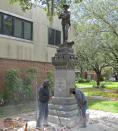 <p>Workers begin removing a Confederate statue in Gainesville, Fla., Monday, Aug. 14, 2017. The statue is being returned to the local chapter of the United Daughters of the Confederacy, which erected the bronze statue in 1904. County officials said they did not know where the statue would be going. (Photo: Jason Dearen/AP) </p>