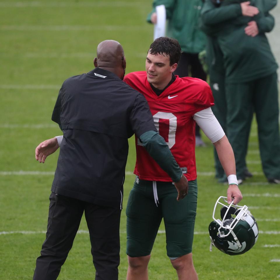 Michigan State quarterback Payton Thorne talks with head coach Mel Tucker after the spring game Saturday, April 24, 2021 at Spartan Stadium in East Lansing.
