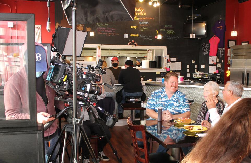 'Man v. Food' host Casey Webb, center, films a segment for the Cooking Channel show at the Hungry Monkey in Newport.