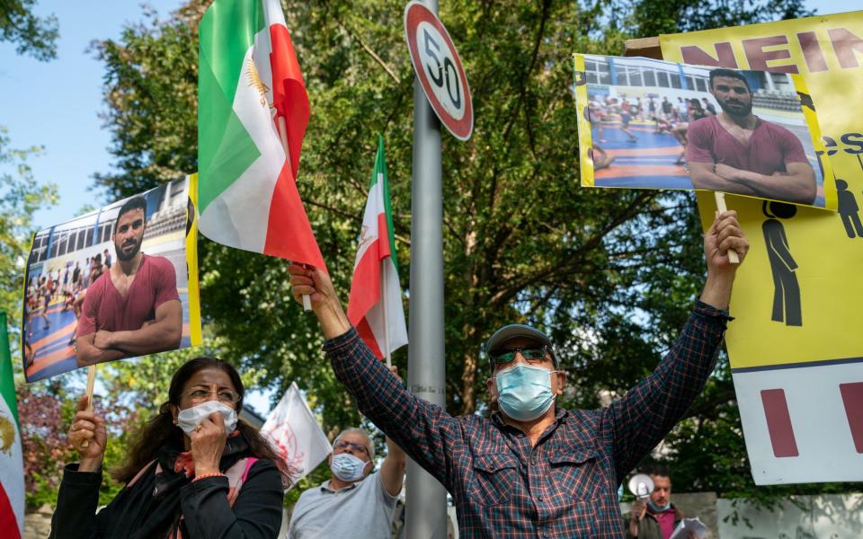 Protests against Navid Afkari's execution at the Iranian embassy in Berlin, Germany - Shutterstock