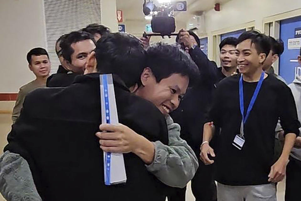 In this photo provided by Thailand's Foreign Ministry, Thai hostages, who were previously released, hug their newly-freed compatriots at the Shamir Medical Center in Israel, Tuesday, Nov. 28, 2023. Hamas freed several Thai nationals seized in the group's surprise attack on southern Israel last month, releasing them alongside Israeli hostages under a cease-fire deal. (Thailand's Foreign Ministry via AP )