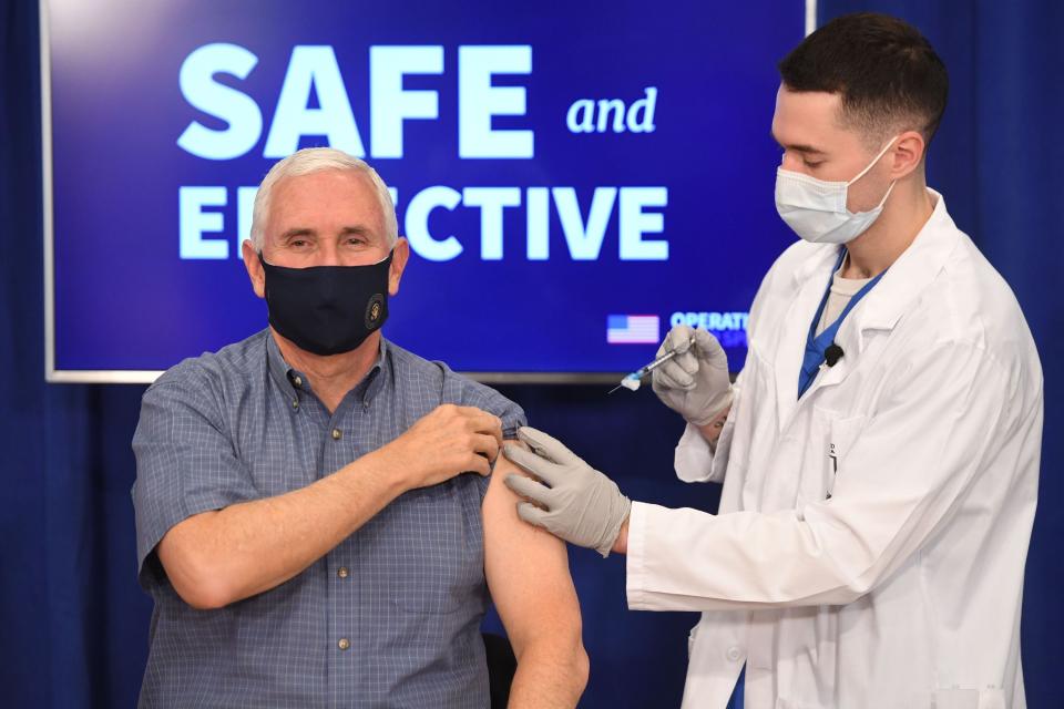 US Vice President Mike Pence receives the COVID-19 vaccine in the Eisenhower Executive Office Building in Washington, DC, December 18, 2020. (Photo by SAUL LOEB / AFP) (Photo by SAUL LOEB/AFP via Getty Images)