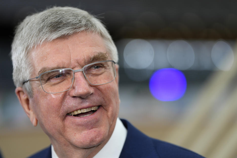 FILE - IOC President Thomas Bach speaks to the media at the International Olympic Committee launch of the Olympic AI Agenda at Lee Valley VeloPark in London, April 19, 2024. The Paris Olympics involve about 10,500 athletes from 200 countries or regions. But the Olympics are more than just fun and games. They are a giant business that generates billions of dollars in income for the International Olympic Committee. (AP Photo/Kirsty Wigglesworth, File)