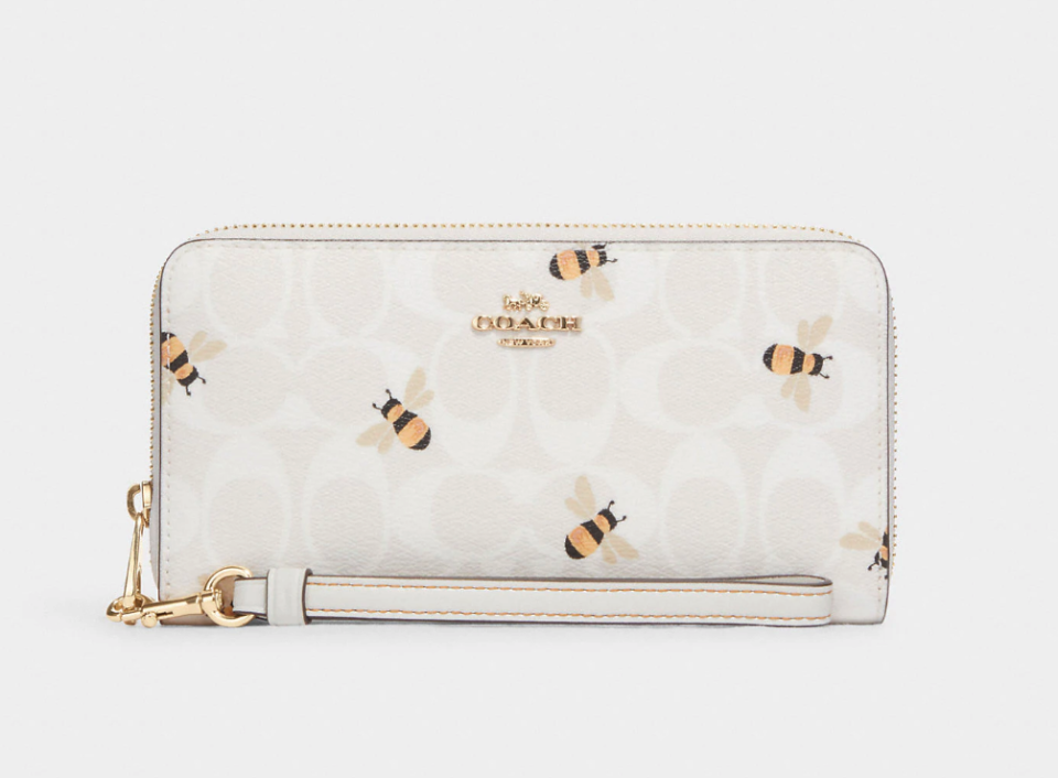 Long Zip Around Wallet In Signature Canvas With Bee Print. Image via Coach Outlet.