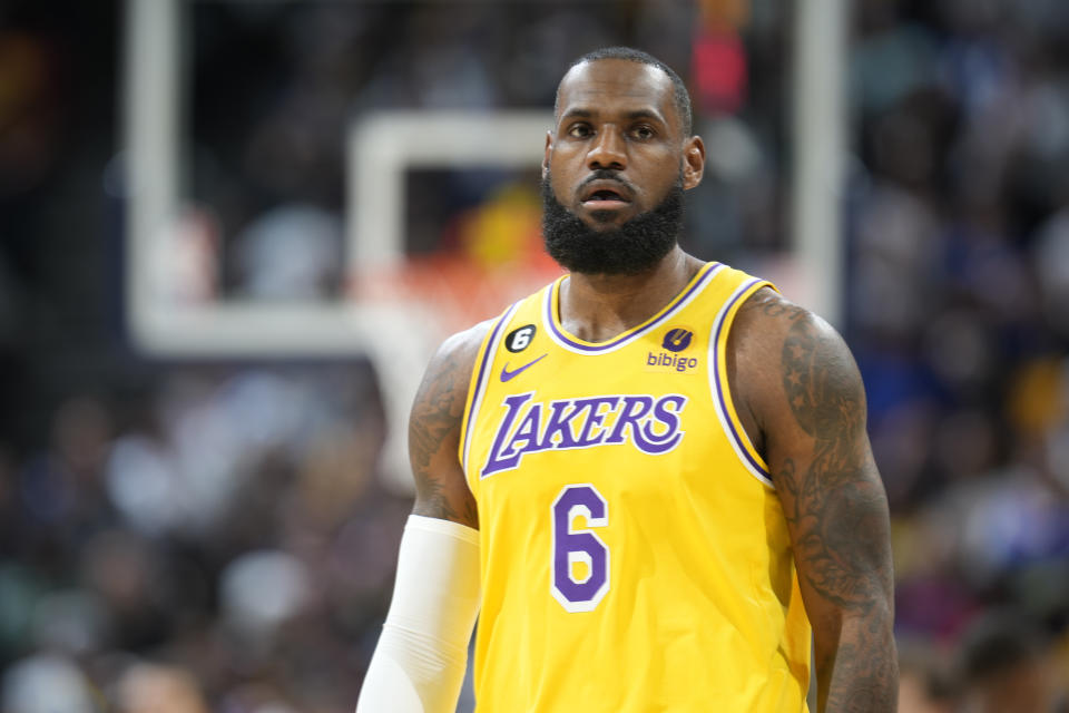 Los Angeles Lakers forward LeBron James looks to the floor during the first half of an NBA basketball game against the Denver Nuggets Wednesday, Oct. 26, 2022, in Denver.  (AP Photo/David Zalubowski)