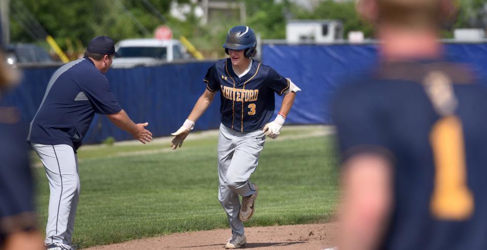 Cole Giesige of Whiteford hits a solo home run against Dundee.