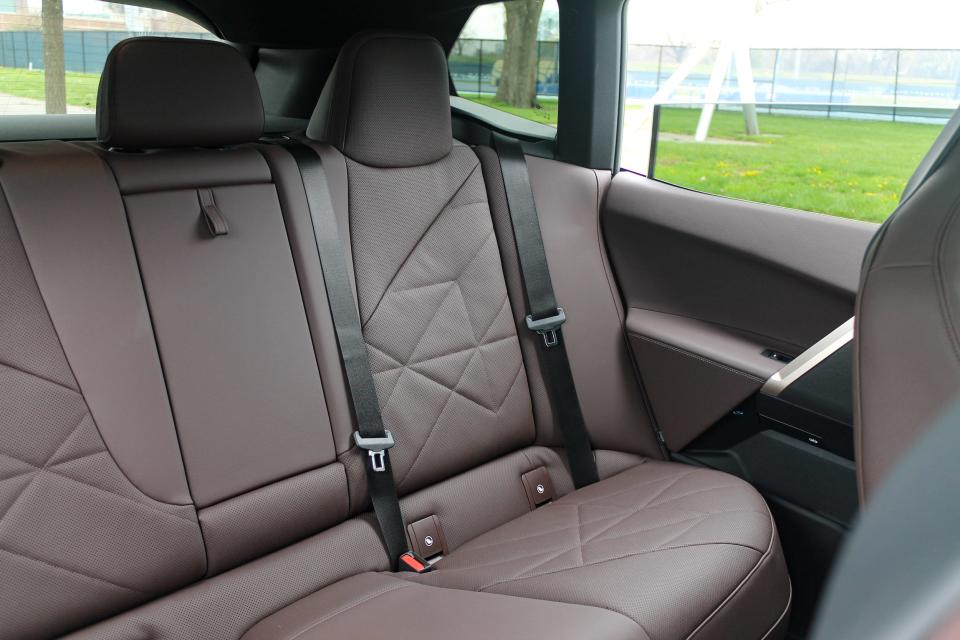 The brown-leather rear seats of the BMW iX SUV.