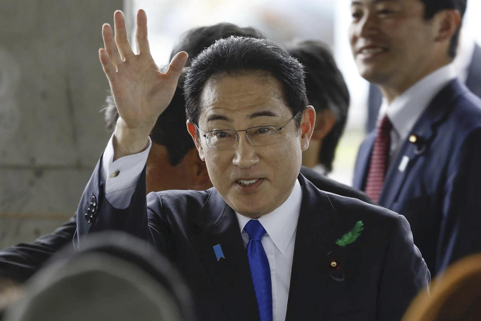 FILE - Japanese Prime Minister Fumio Kishida waves as he visits a port in Wakayama, western Japan to cheer his ruling party's candidate in a local election, on April 15, 2023. Prosecutors in Japan indicted the 24-year-old man Wednesday, Sept. 6, 2023 on attempted murder and other charges in the explosive attack on Prime Minister Fumio Kishida in April, Japanese media reported. (Kyodo News via AP, File)