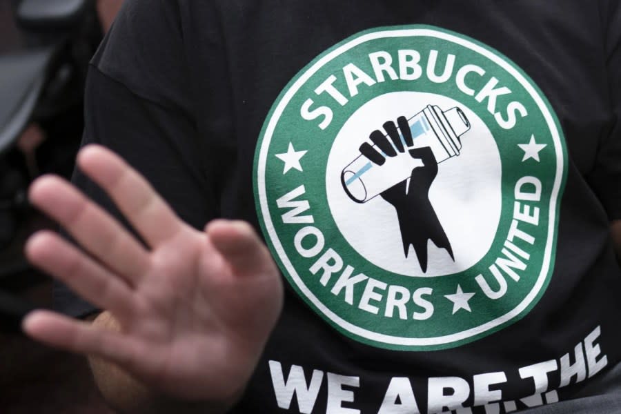 The Starbucks Workers United logo appears on the shirt of a former Starbucks employee attending a hearing at the Capitol in Washington, on March 29, 2023. (AP Photo/J. Scott Applewhite, File)